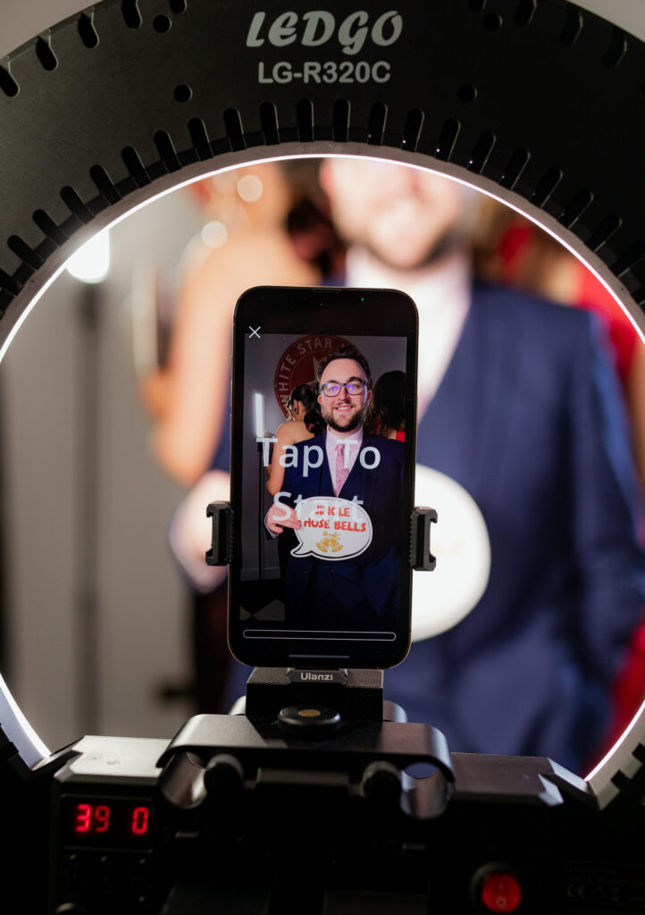 Guest sharing a photo booth image from a phone
