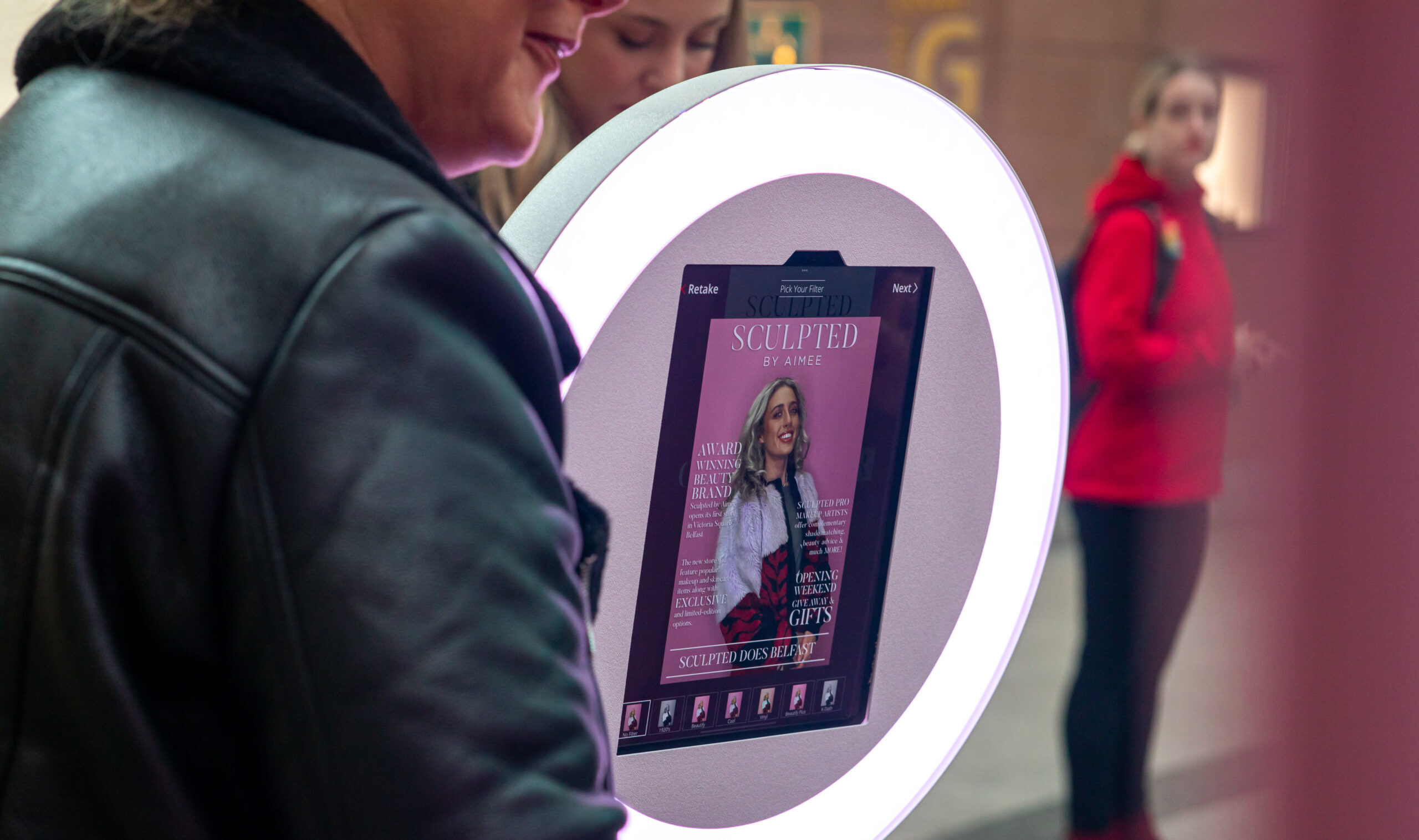 Guest being photographed at a ring light booth