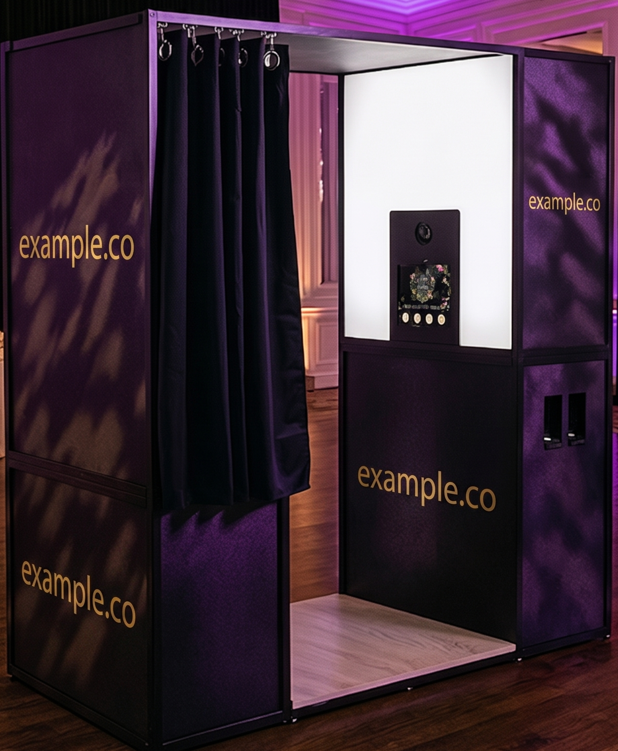 Photo booth with purple draping set up at an evening event