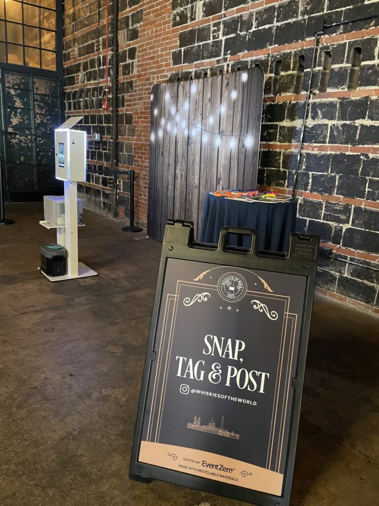 Photo booth with event signage set up inside a retail space