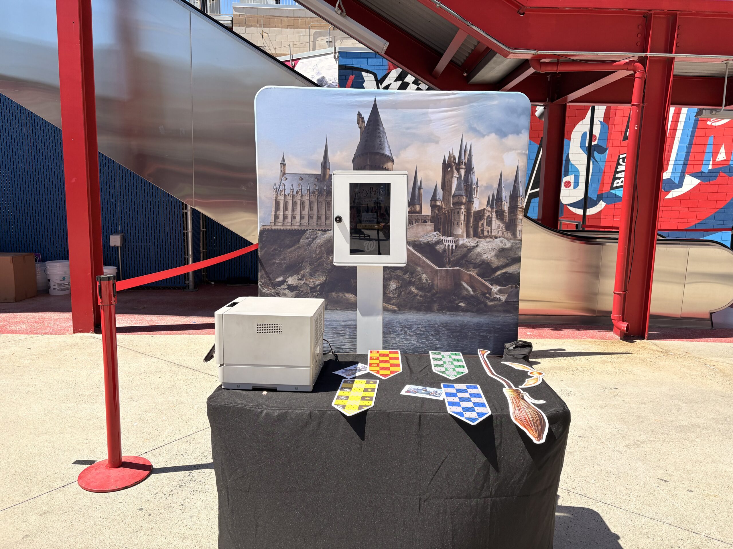 Photo booth on a branded table with a Washington DC skyline backdrop