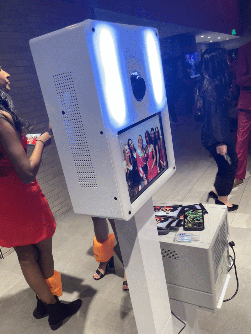 Photo booth positioned in a retail aisle for a brand activation