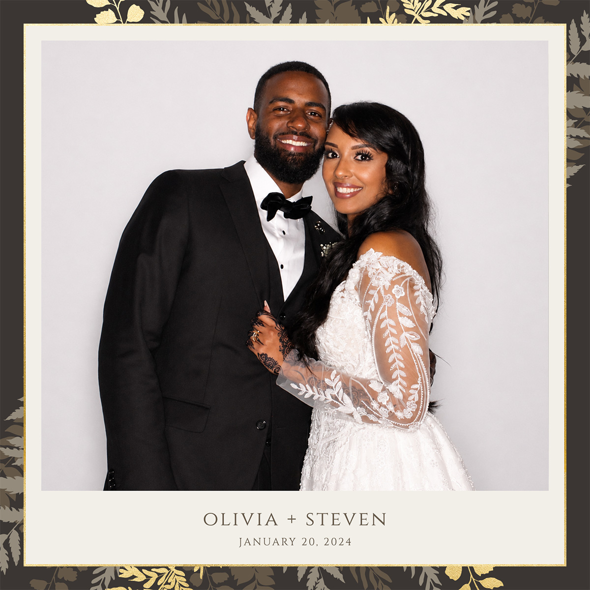 Framed wedding photo booth print with a custom monogram overlay