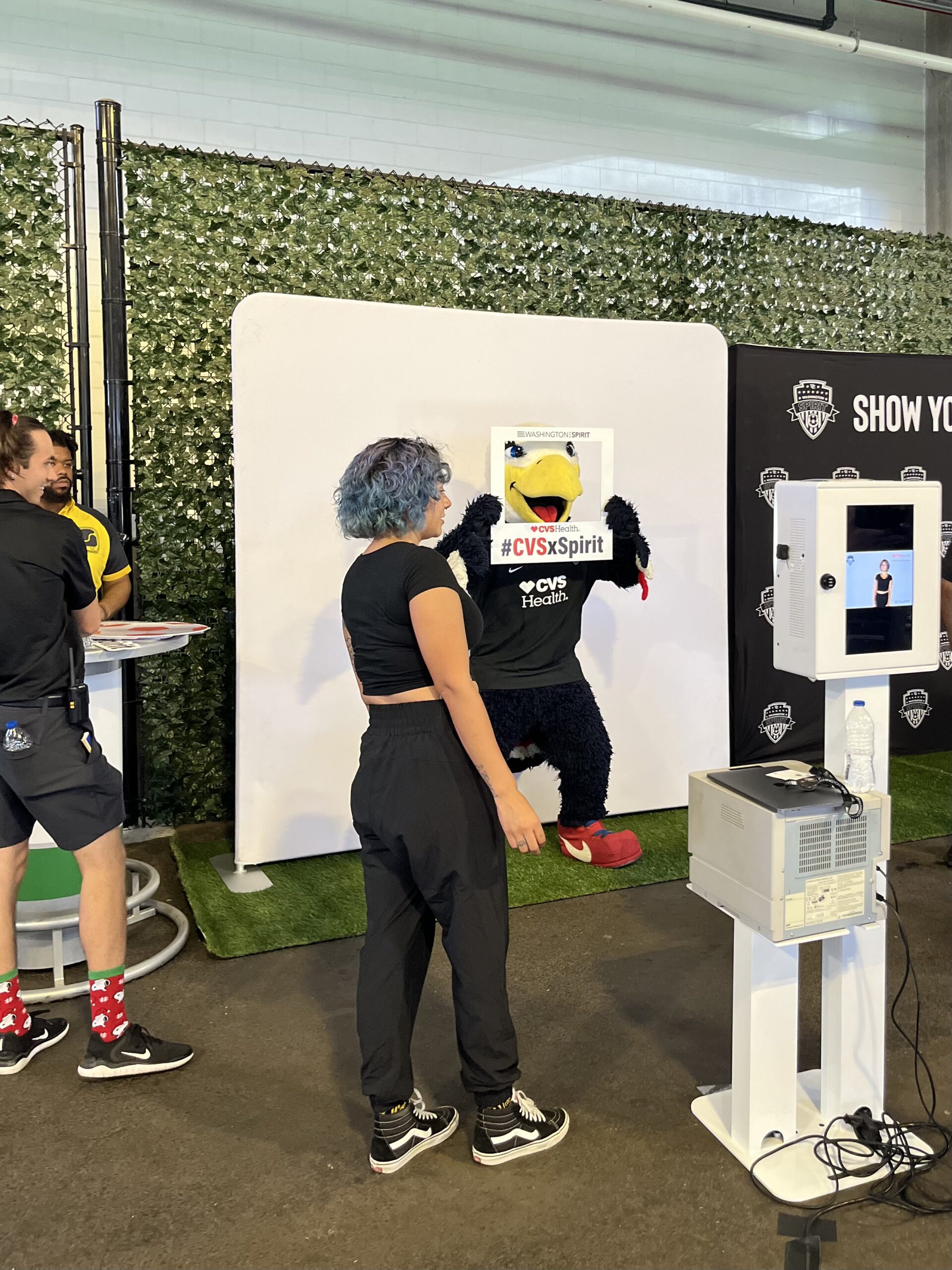 Outdoor brand activation photo booth with attendants on site