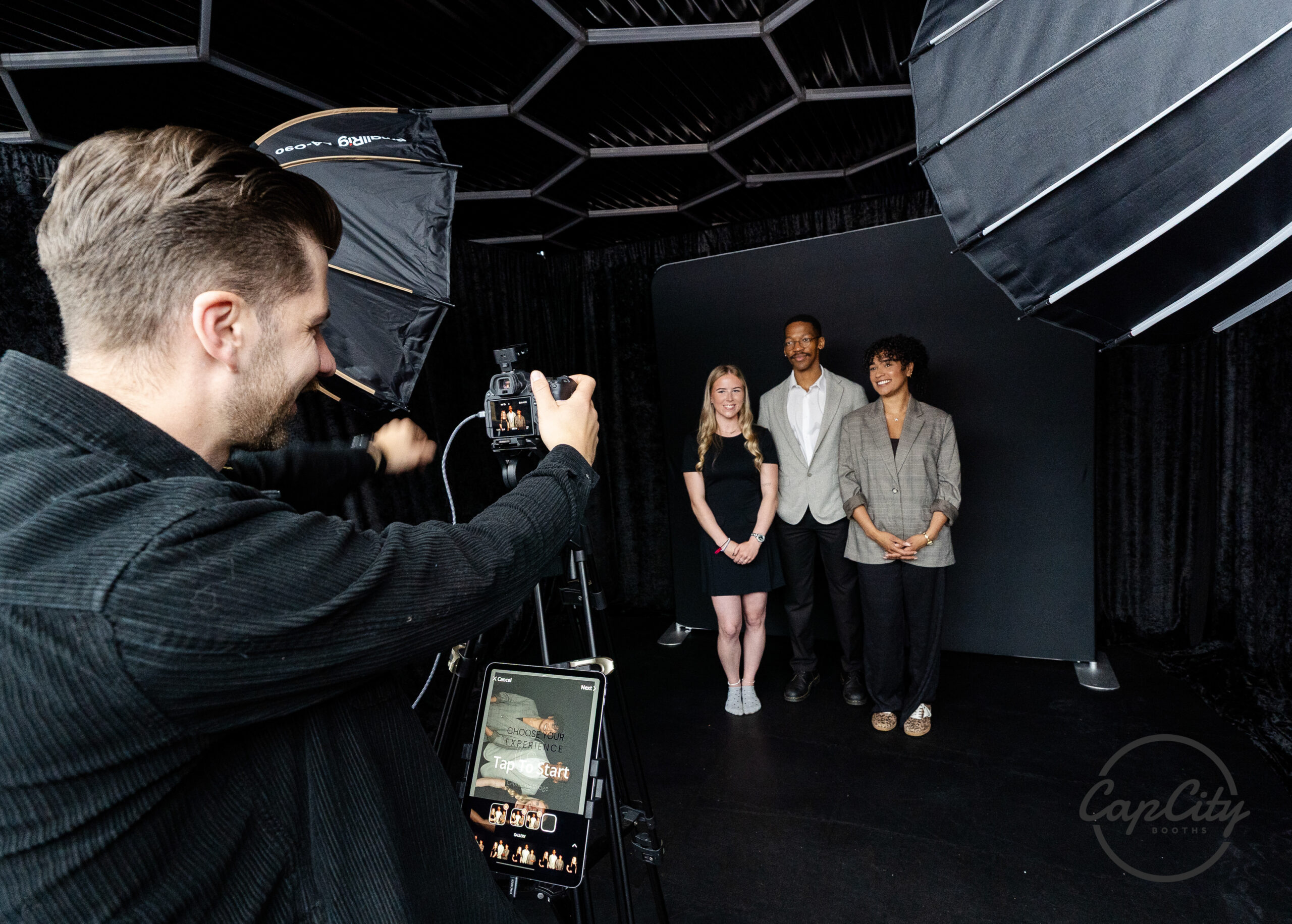 Studio photo booth with professional lighting capturing a group portrait