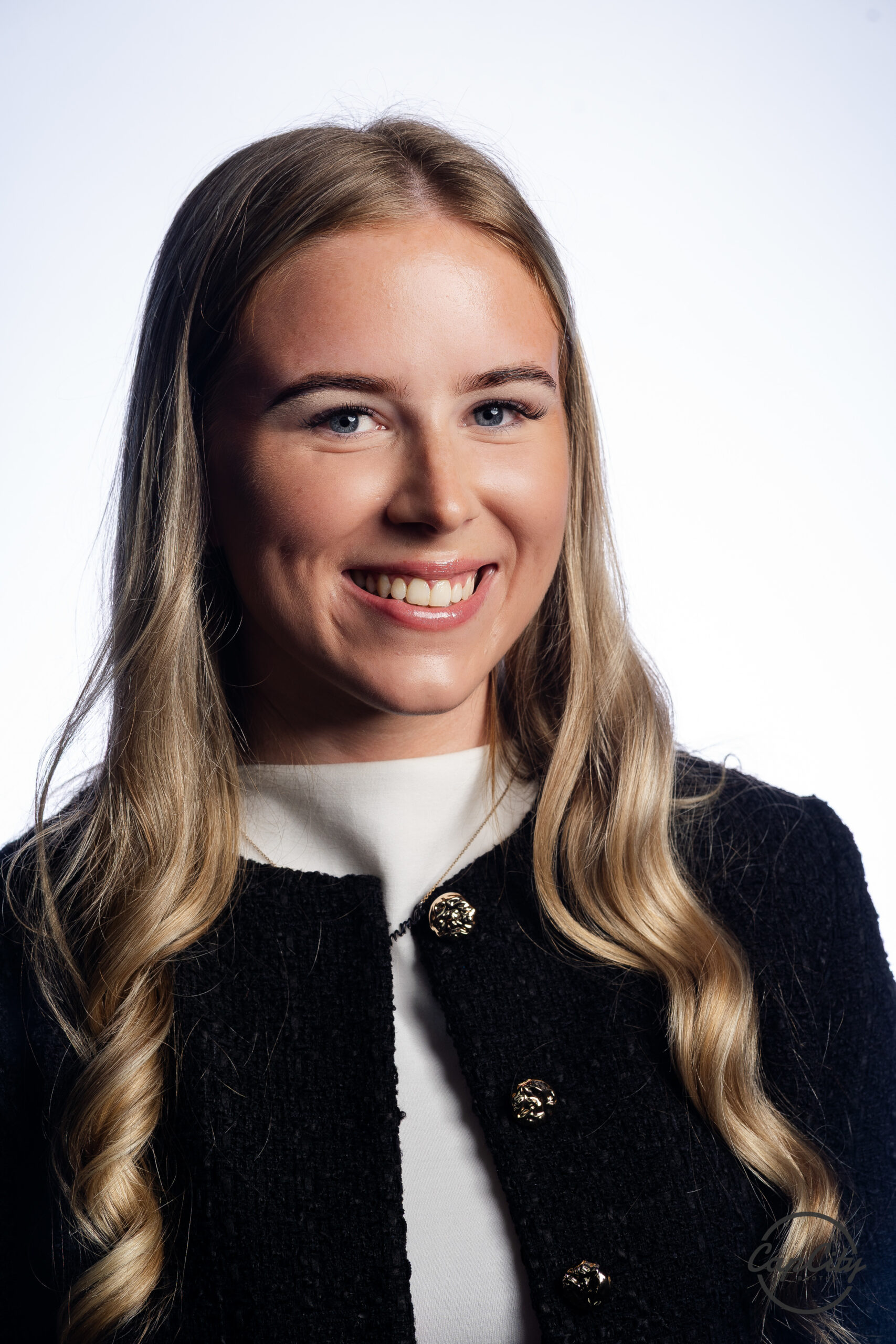 AI headshot booth portrait of a smiling female guest at a corporate event