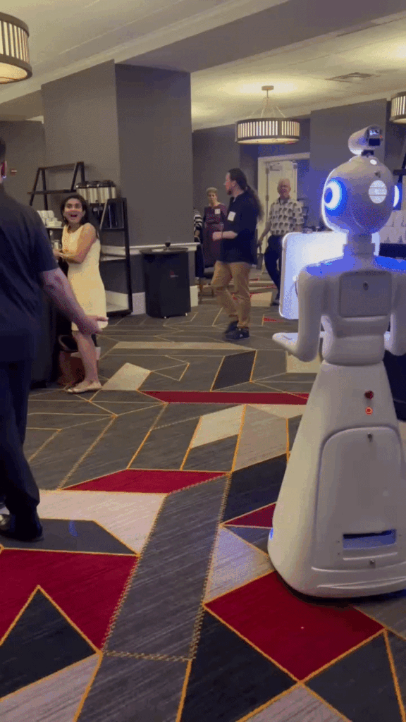 Robot photo booth moving through a ballroom during an event